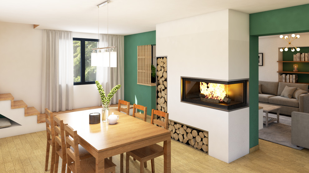 Idée de décoration pour une grande salle à manger design avec un mur vert, parquet clair, un poêle à bois, un manteau de cheminée en plâtre et du papier peint.