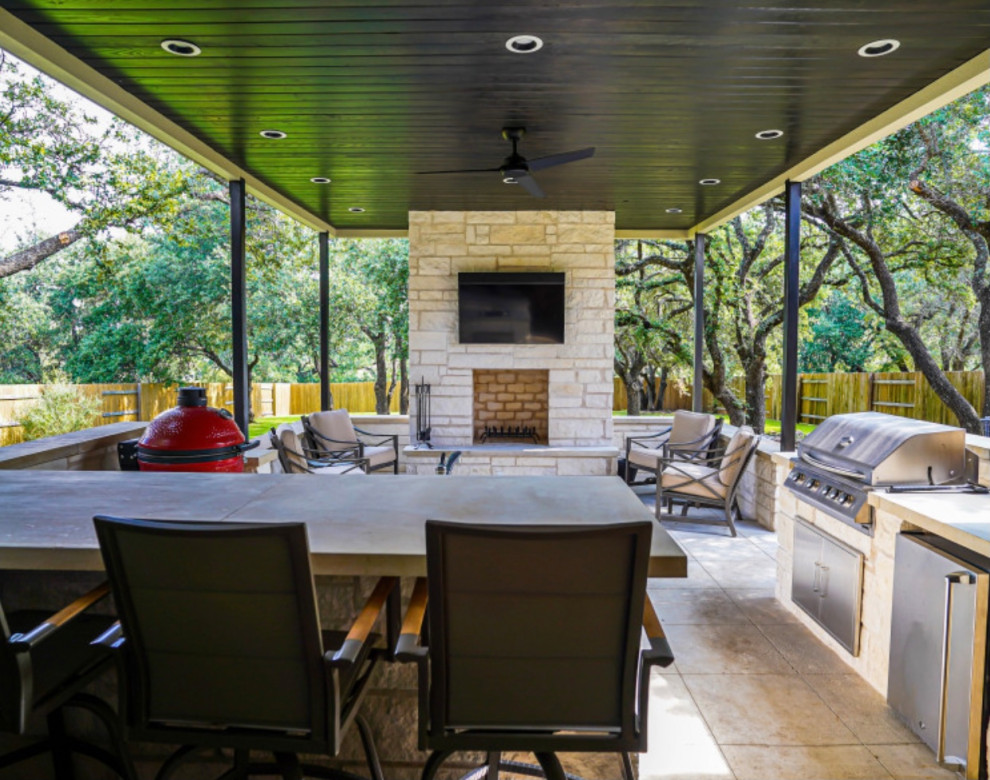 Design ideas for a small traditional back fully shaded garden for summer in Austin with a fireplace and natural stone paving.