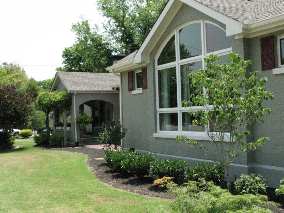 Mid-sized transitional gray one-story brick gable roof idea with a shingle roof