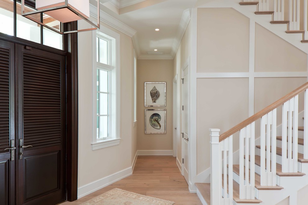 Front door - mid-sized light wood floor front door idea in Miami with beige walls and a dark wood front door