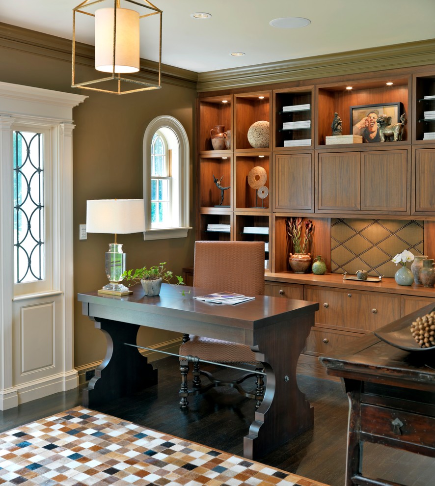 Photo of a transitional home office in Boston with green walls, dark hardwood floors and a freestanding desk.