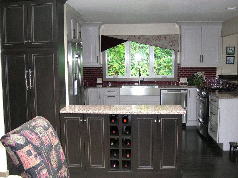 Transitional eat-in kitchen photo in Philadelphia with an undermount sink, recessed-panel cabinets, white cabinets, quartz countertops, glass tile backsplash and stainless steel appliances
