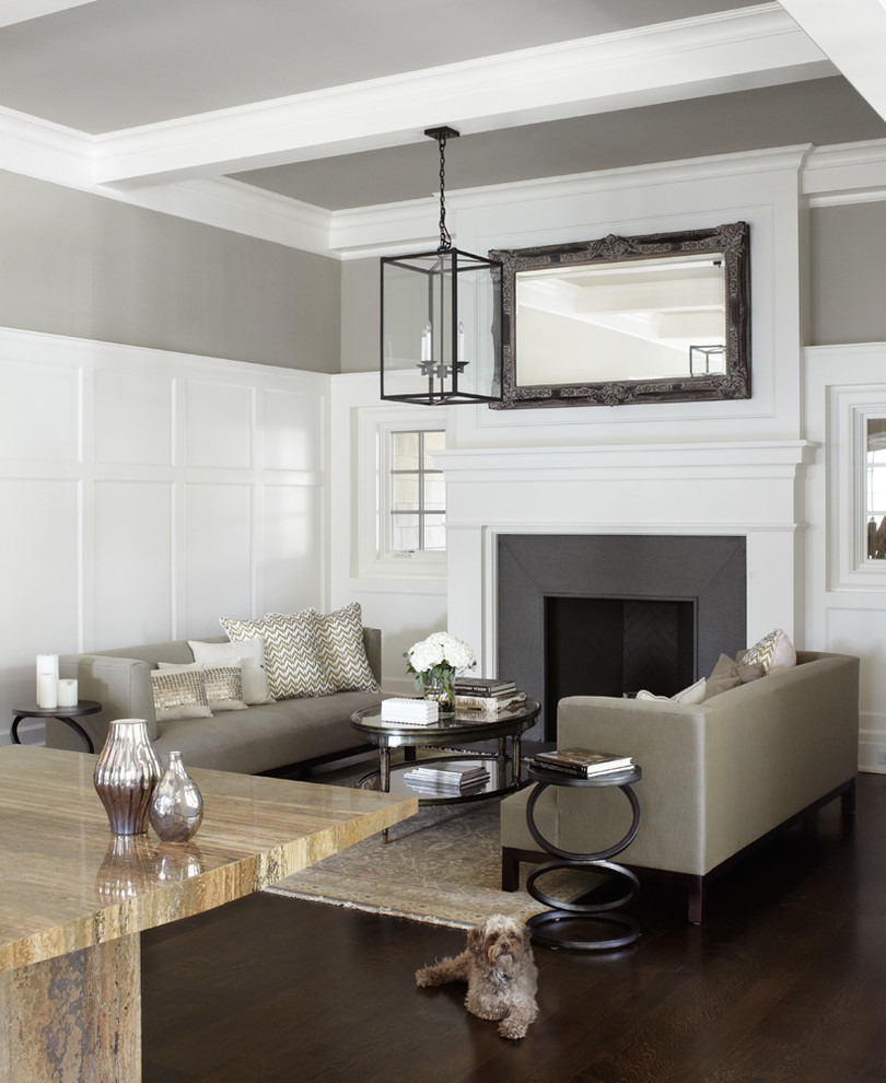 This is an example of a large contemporary open concept family room in Chicago with white walls, dark hardwood floors, a standard fireplace, a plaster fireplace surround, no tv and brown floor.