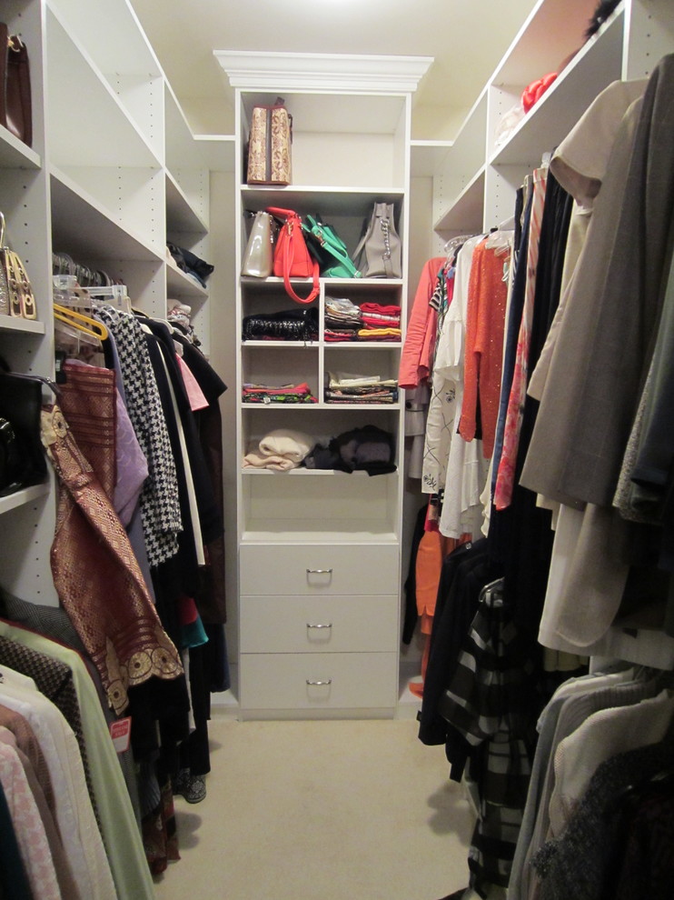 Mid-sized traditional walk-in wardrobe in DC Metro with flat-panel cabinets, white cabinets and carpet.