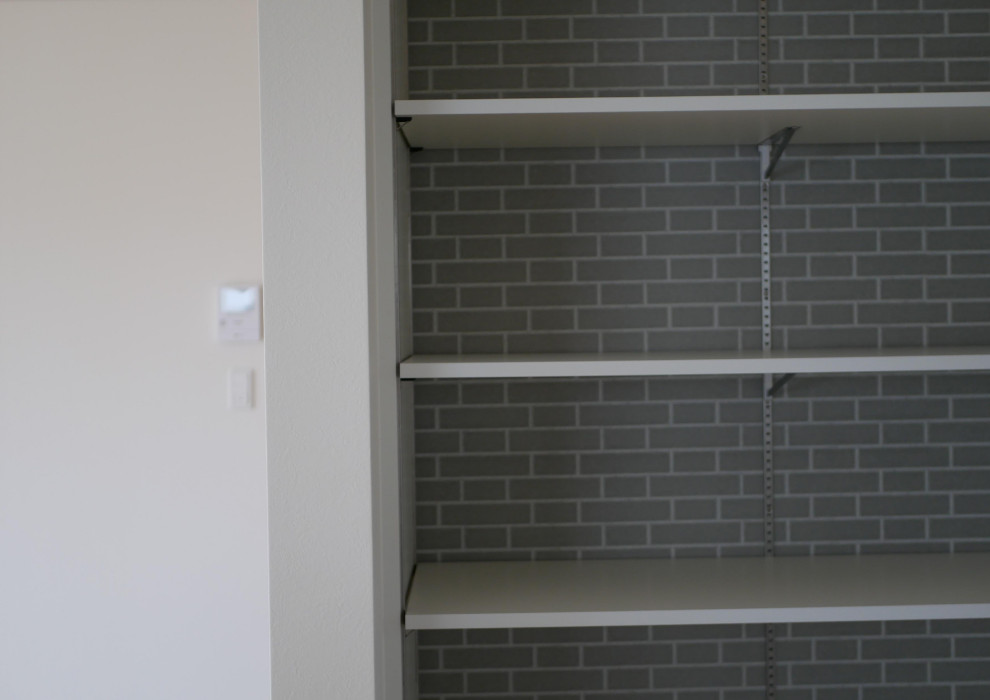 Photo of a medium sized scandi standard wardrobe in Other with open cabinets.