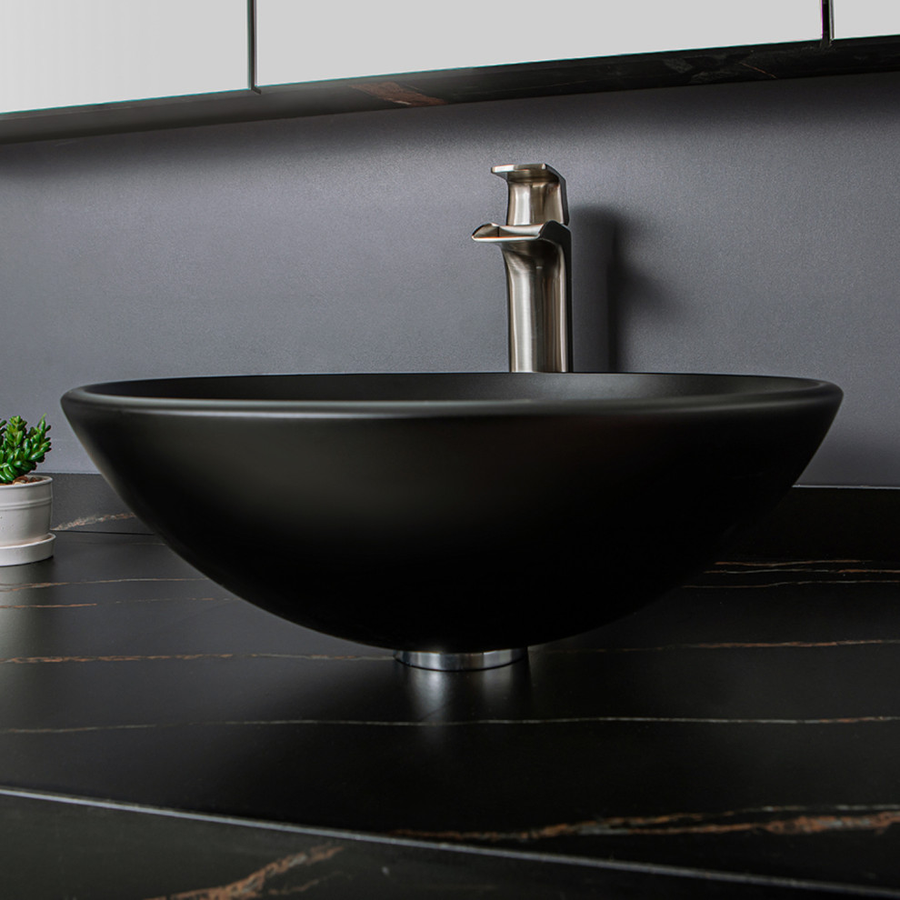This is an example of a small contemporary ensuite bathroom in Nashville with open cabinets, black cabinets, black worktops, a single sink and a floating vanity unit.