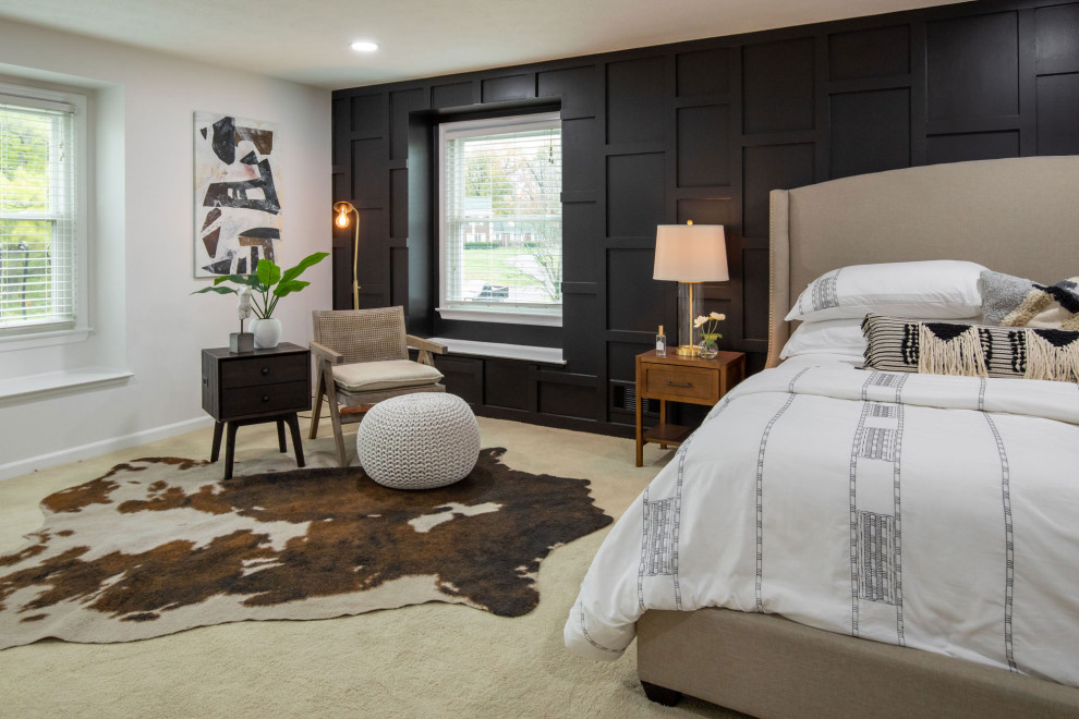 Inspiration for a large transitional master bedroom in Indianapolis with black walls, carpet, no fireplace, beige floor and panelled walls.