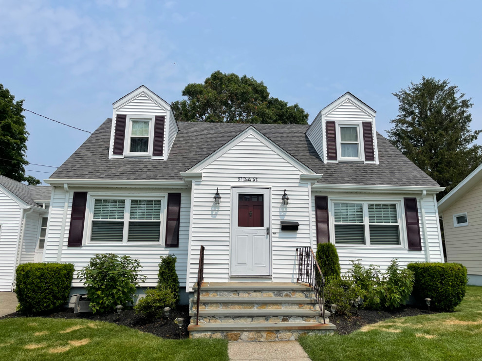 Example of a trendy house exterior design in Providence with a shingle roof