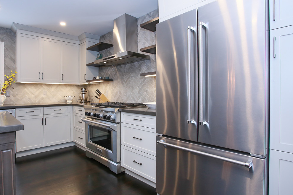 Eat-in kitchen - large transitional l-shaped dark wood floor and brown floor eat-in kitchen idea in Toronto with an undermount sink, shaker cabinets, gray cabinets, quartz countertops, gray backsplash, porcelain backsplash, stainless steel appliances and an island