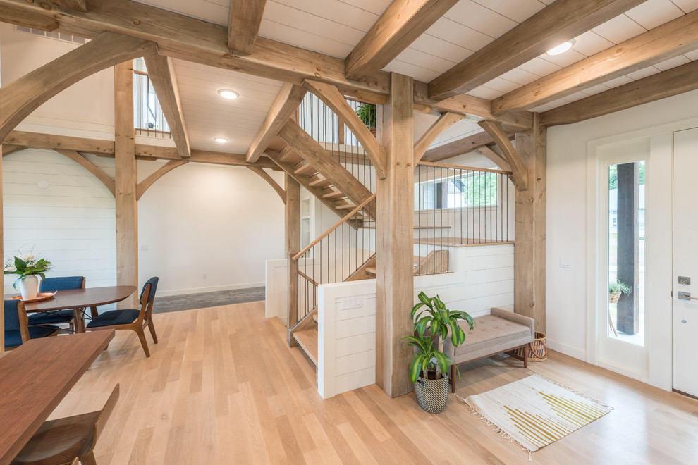 Inspiration for a mid-sized rustic wooden u-shaped open and mixed material railing staircase remodel in Minneapolis