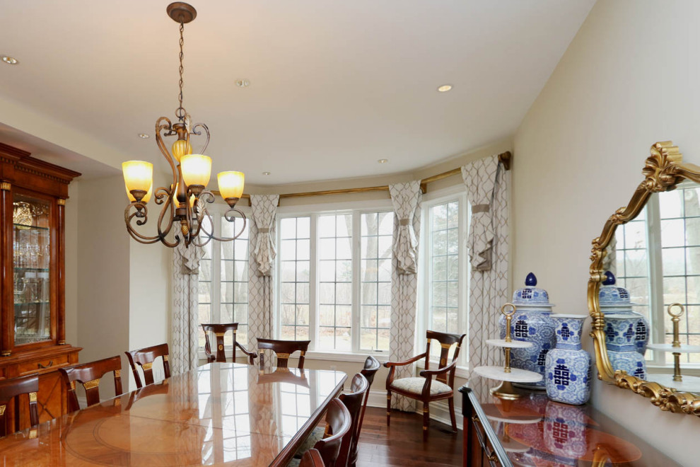 Large traditional separate dining room in Boston with beige walls and dark hardwood floors.