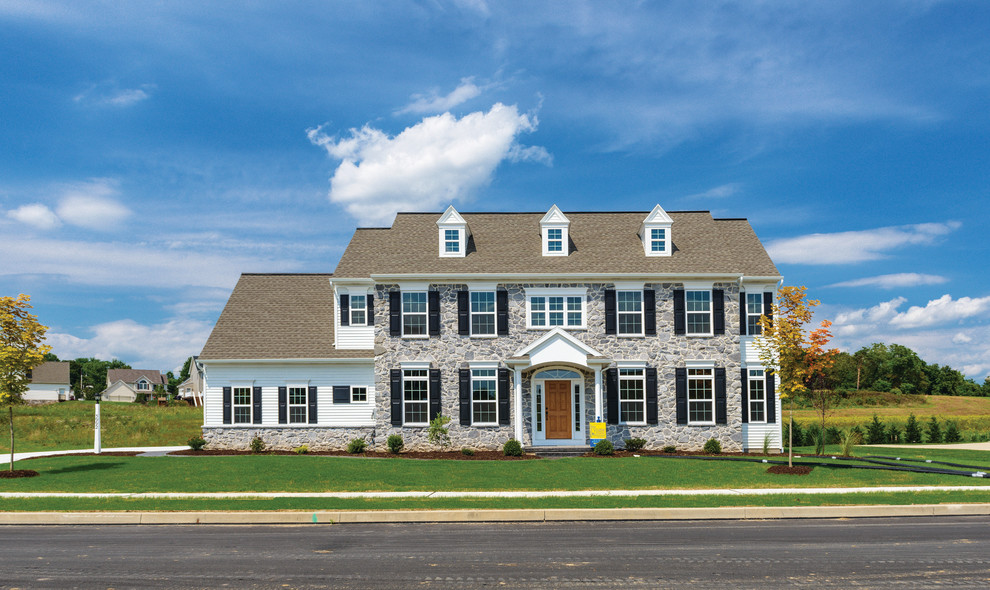 Inspiration for a mid-sized timeless two-story gray home design remodel