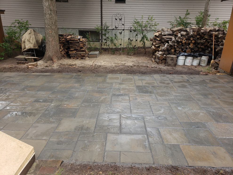 This is an example of a mid-sized rustic shade backyard concrete paver walkway in Edmonton for summer.