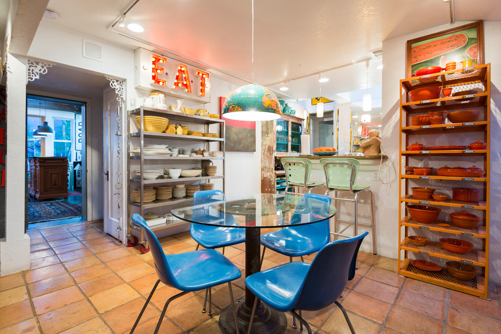 Inspiration for a mid-sized eclectic terra-cotta tile kitchen/dining room combo remodel in San Francisco with white walls and no fireplace