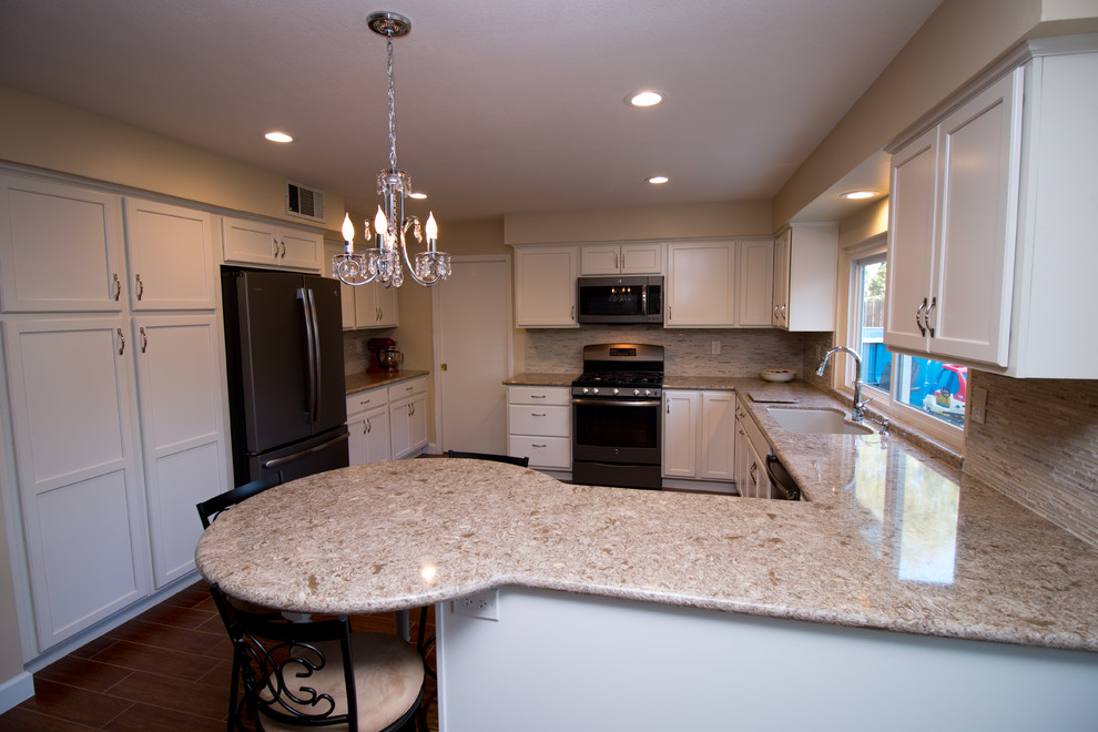 Example of a mid-sized transitional u-shaped porcelain tile open concept kitchen design with an undermount sink, recessed-panel cabinets, beige cabinets, quartz countertops, beige backsplash, mosaic tile backsplash and colored appliances
