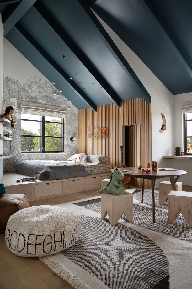 Hill Country Modern Meets Southlake, Texas - This Hill Country Modern home in Southlake combines modern design with comfort, featuring light-filled spaces and unique details reflecting the family's eclectic style for play and sophistication. 

This playful kid's room features a blue ceiling that adds a touch of whimsy. It is complemented by an elegant gray-patterned accent wall and charming decor, creating a stylish and inviting space.