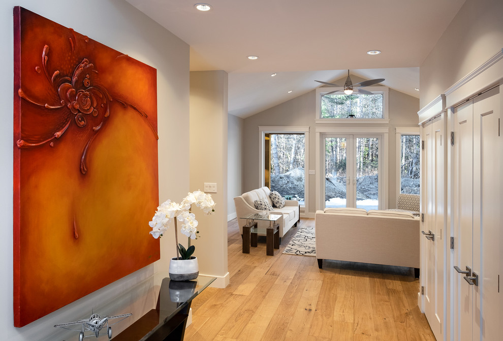 Large traditional hallway in Other with white walls, light hardwood floors and beige floor.