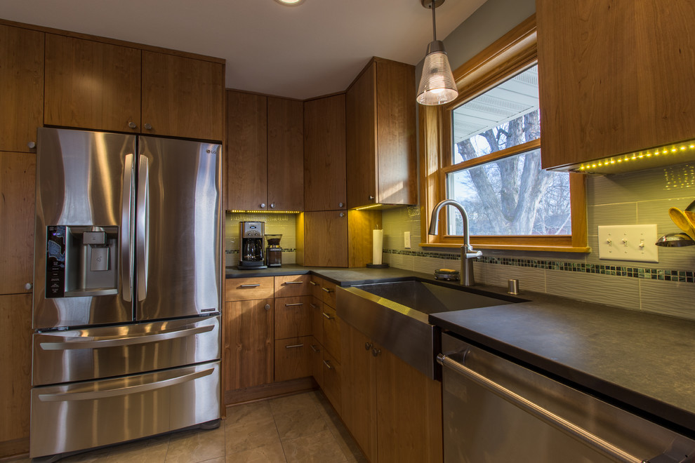 This is an example of a contemporary kitchen in Minneapolis with stainless steel appliances and with island.