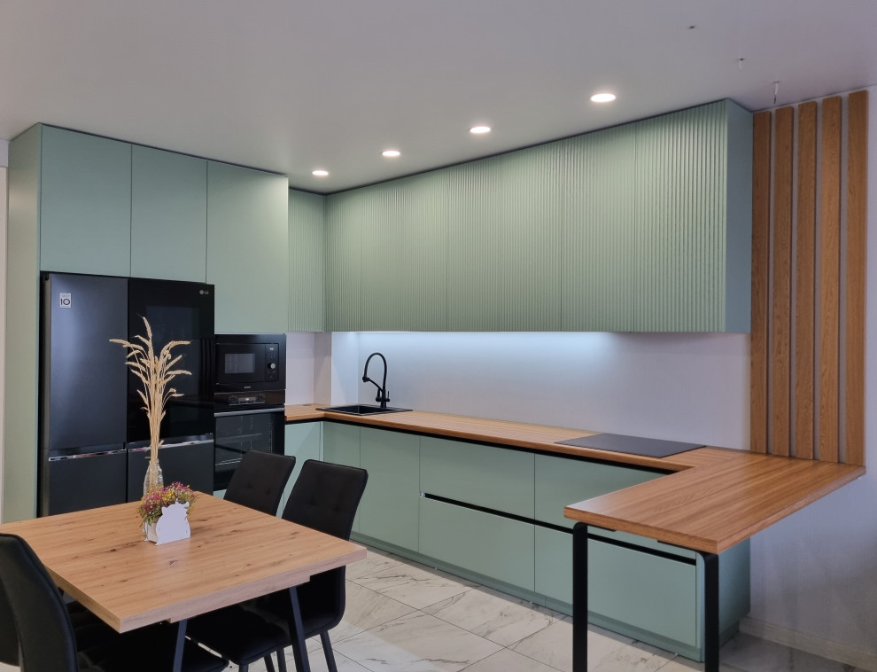 This is an example of a medium sized contemporary l-shaped kitchen/diner in Other with a built-in sink, turquoise cabinets, laminate countertops and a breakfast bar.