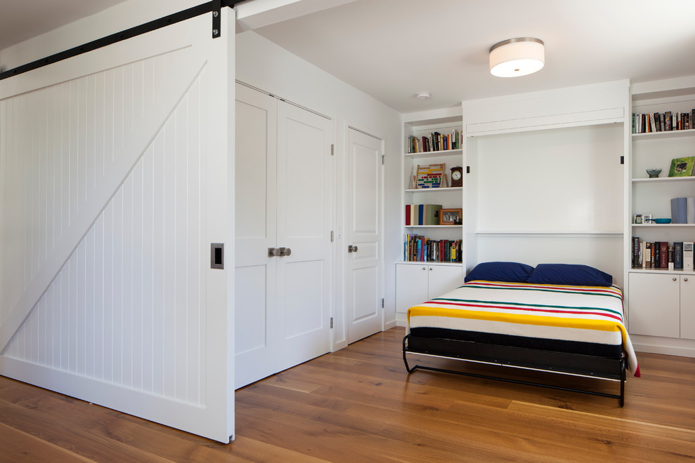 Inspiration for a contemporary bedroom in San Francisco with white walls and medium hardwood floors.
