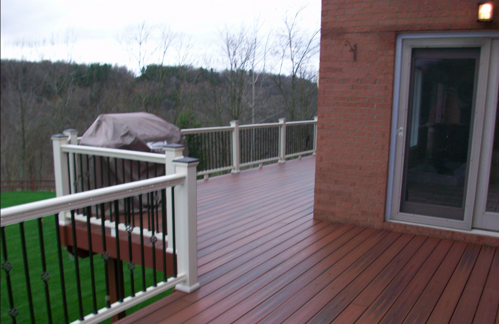 Large backyard deck photo with decking and no cover