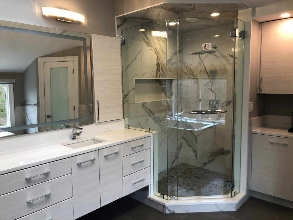Mid-sized contemporary master bathroom in New York with flat-panel cabinets, white cabinets, a freestanding tub, a corner shower, a one-piece toilet, gray tile, porcelain tile, grey walls, porcelain floors, an undermount sink, quartzite benchtops, grey floor, white benchtops, a niche, a double vanity and a floating vanity.
