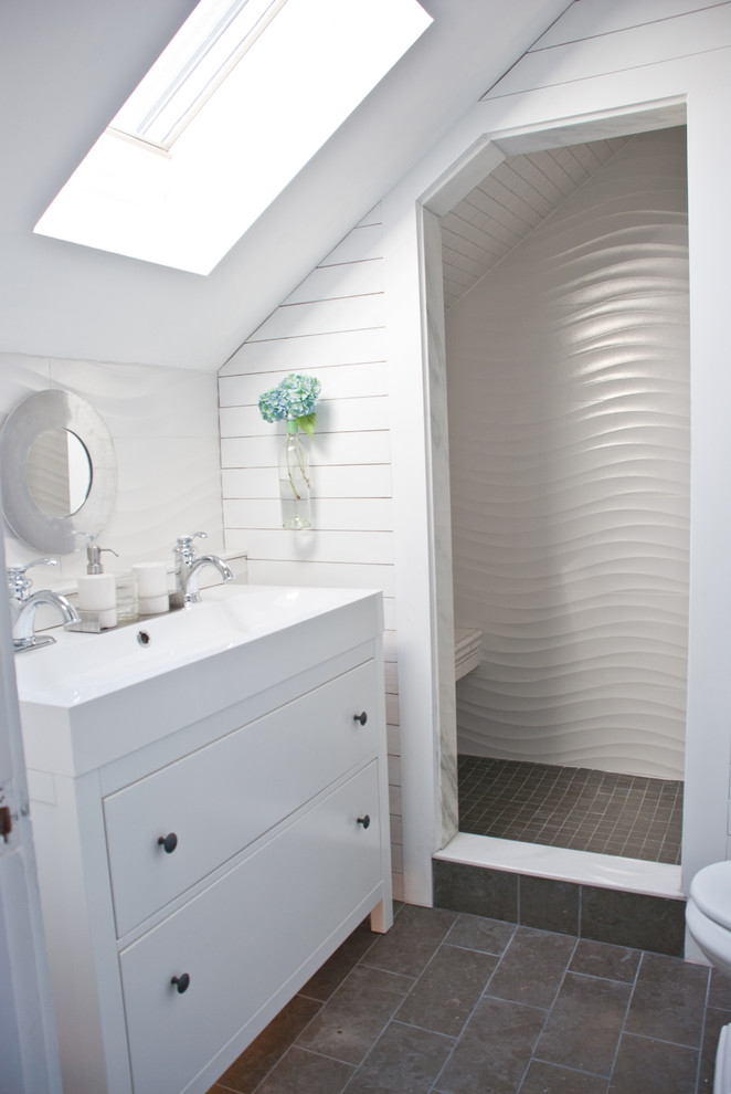 Inspiration for a mid-sized transitional white tile and porcelain tile limestone floor alcove shower remodel in Boston with a trough sink, furniture-like cabinets, white cabinets, quartz countertops, a one-piece toilet and white walls