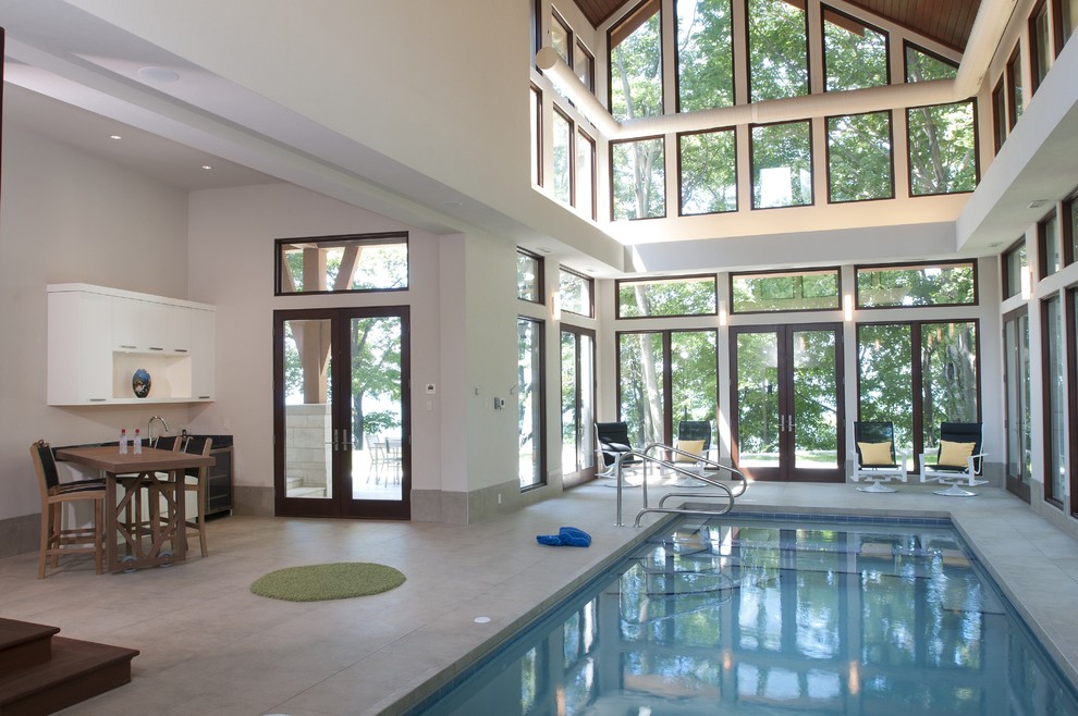 Design ideas for a large contemporary indoor rectangular pool in Grand Rapids.
