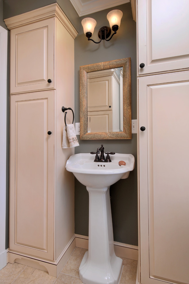 This is an example of a mid-sized contemporary master bathroom in DC Metro with beaded inset cabinets, beige cabinets, a corner tub, a corner shower, a wall-mount toilet, multi-coloured tile, ceramic tile, grey walls, ceramic floors, an undermount sink, granite benchtops, beige floor and a hinged shower door.
