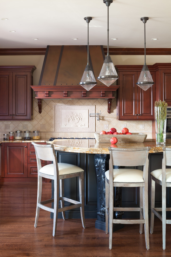 Traditional kitchen in Denver with raised-panel cabinets, dark wood cabinets, beige splashback, dark hardwood floors and with island.