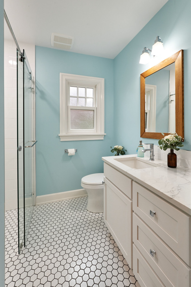 Design ideas for a medium sized classic bathroom in Portland with shaker cabinets, white cabinets, an alcove shower, white tiles, metro tiles, blue walls, a submerged sink, white floors, a sliding door, white worktops, a single sink and a freestanding vanity unit.