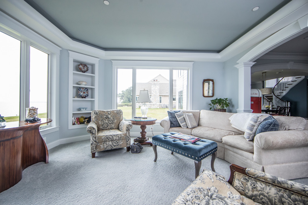 This is an example of a mid-sized traditional enclosed family room in DC Metro with grey walls, carpet, no fireplace, a wall-mounted tv and blue floor.