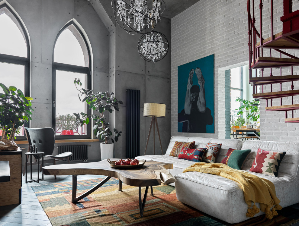 This is an example of a medium sized urban mezzanine living room in Moscow with white walls, medium hardwood flooring, a corner fireplace, a metal fireplace surround, a wall mounted tv and blue floors.
