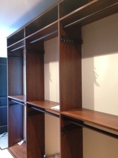 Inspiration for a large contemporary men's dressing room in Toronto with shaker cabinets and medium wood cabinets.