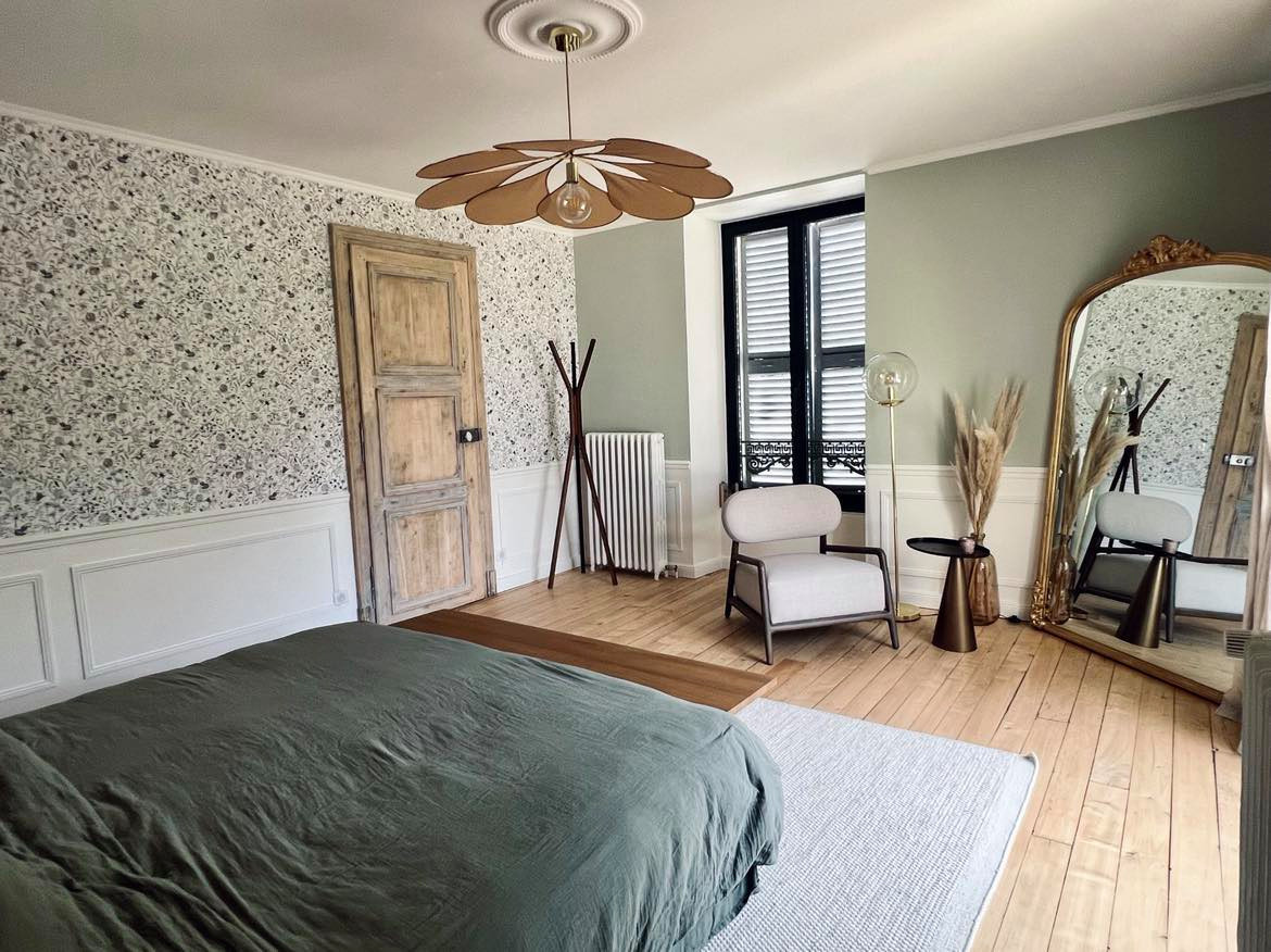 Inspiration for a large cottage master light wood floor, brown floor and wallpaper bedroom remodel in Reims with gray walls and no fireplace