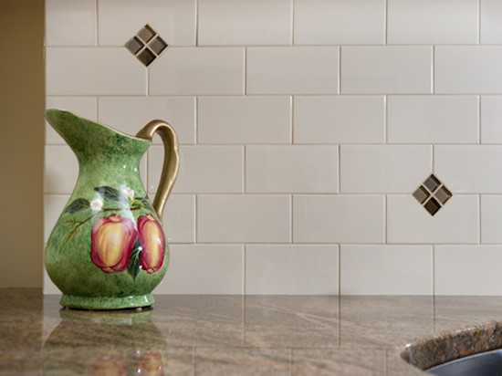 Inspiration for a kitchen remodel in Boston with white backsplash