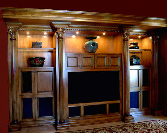 This is an example of a traditional living room in Phoenix with travertine floors and a built-in media wall.