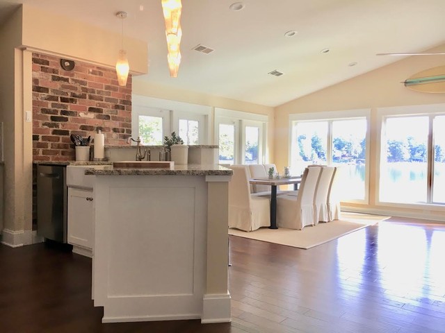 Great room - mid-sized eclectic medium tone wood floor and brown floor great room idea in Charlotte with yellow walls