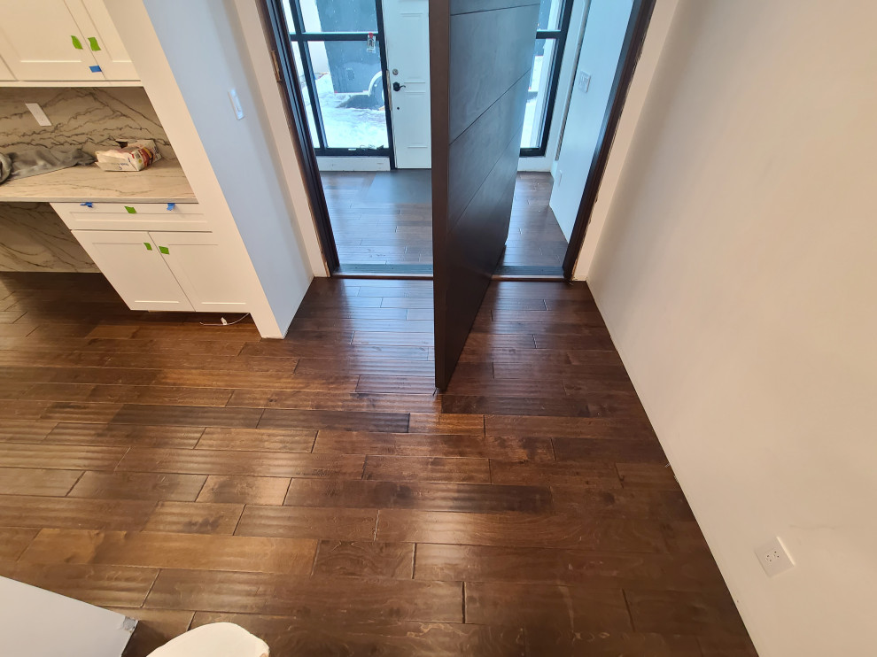 Sleek Engineered Hardwood & Modern Sliding Door by I’m The Man Services