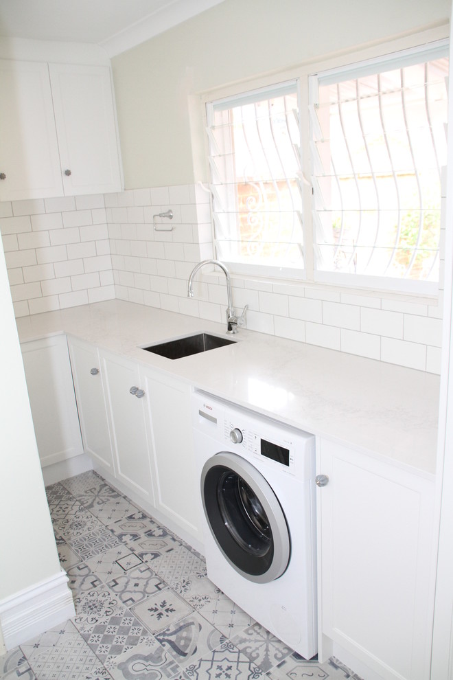 Design ideas for a traditional l-shaped utility room in Perth with an undermount sink, shaker cabinets, white cabinets and quartz benchtops.