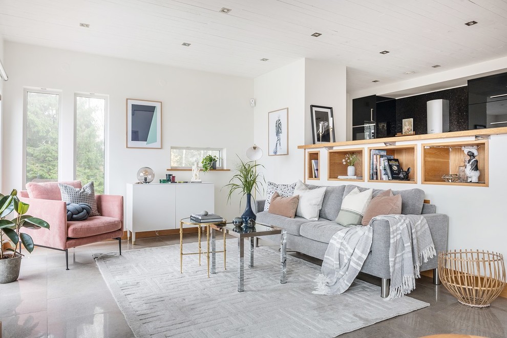 Photo of a contemporary living room in Stockholm with white walls and grey floor.