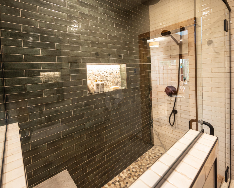 Example of a large mountain style master multicolored tile and ceramic tile porcelain tile, gray floor and double-sink doorless shower design with shaker cabinets, medium tone wood cabinets, a one-piece toilet, beige walls, an undermount sink, quartzite countertops, a hinged shower door, gray countertops, a niche and a floating vanity