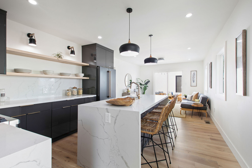 Inspiration for a small scandinavian l-shaped separate kitchen in San Francisco with a single-bowl sink, flat-panel cabinets, grey cabinets, quartzite benchtops, white splashback, stone slab splashback, black appliances, light hardwood floors, with island and white benchtop.