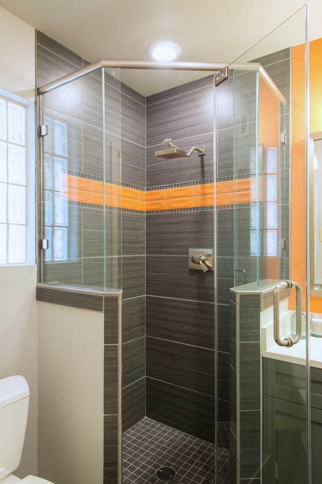 Inspiration for a small contemporary master bathroom in Dallas with a drop-in sink, flat-panel cabinets, dark wood cabinets, engineered quartz benchtops, an alcove shower, a one-piece toilet, gray tile, porcelain tile, grey walls and porcelain floors.