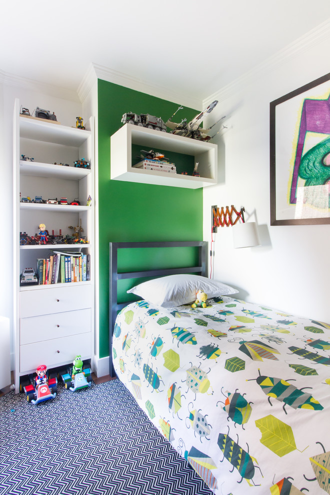 Photo of a contemporary kids' bedroom for kids 4-10 years old and boys in New York with green walls, dark hardwood floors and brown floor.