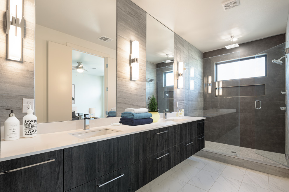 Inspiration for a modern master bathroom in Dallas with raised-panel cabinets, white cabinets, gray tile, white walls, porcelain floors, a drop-in sink, quartzite benchtops, grey floor, a hinged shower door, white benchtops, a niche, a double vanity and a built-in vanity.