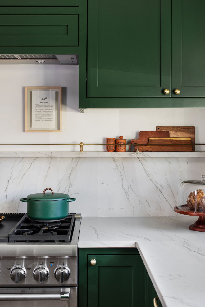 Mid-sized transitional u-shaped medium tone wood floor and brown floor open concept kitchen photo in Austin with an undermount sink, shaker cabinets, green cabinets, quartzite countertops, white backsplash, stone slab backsplash, stainless steel appliances, an island and white countertops