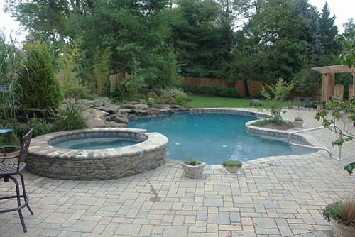 Design ideas for a large rustic swimming pool in New York.