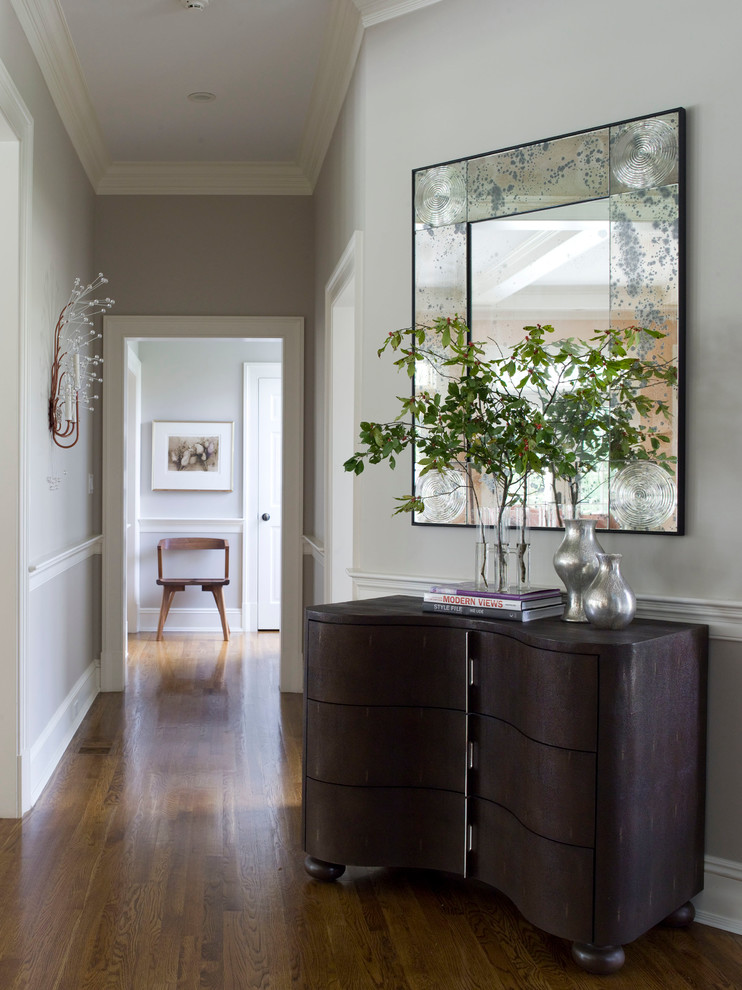 Inspiration for a contemporary hallway in Dallas with grey walls, medium hardwood floors and brown floor.