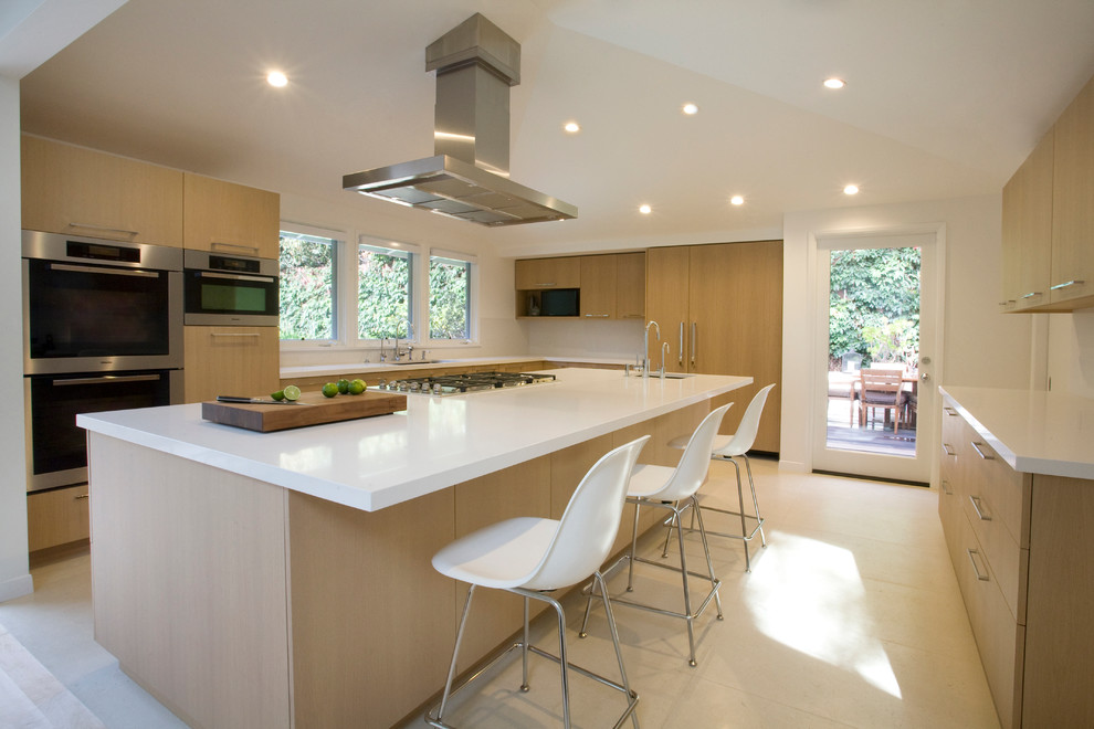 Design ideas for a large modern u-shaped open plan kitchen in Dallas with an undermount sink, flat-panel cabinets, light wood cabinets, quartz benchtops, white splashback, stone slab splashback, panelled appliances, ceramic floors and with island.